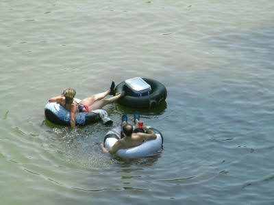 People floating on tubes